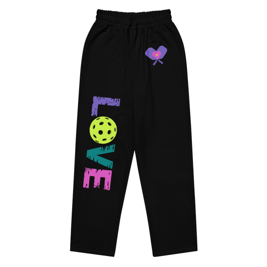 Women's black wide-leg joggers featuring colorful LOVE design and pickleball graphic