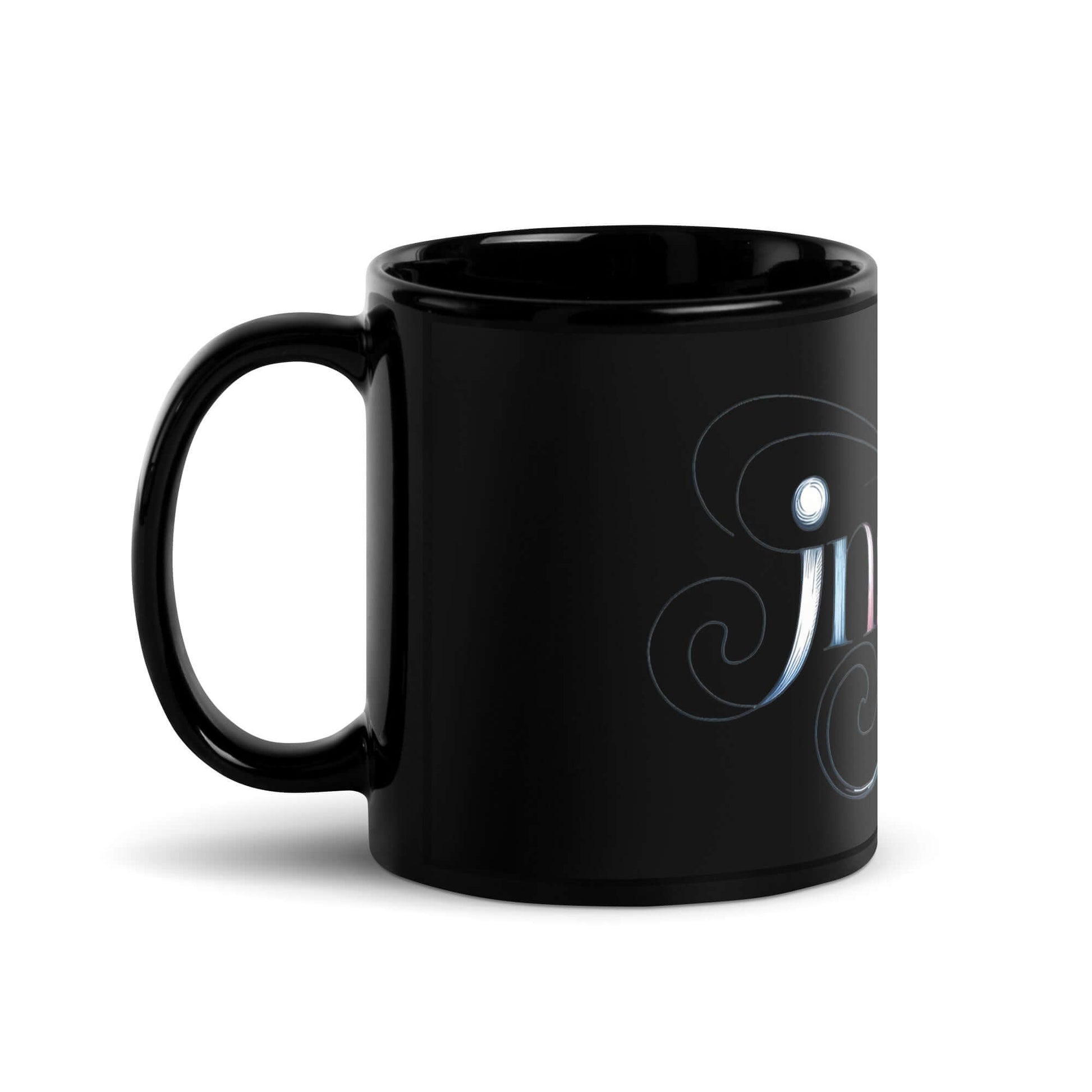 Inspire Sketch Black Glossy Mug showcasing elegant word art design emphasizing creativity and imagination.