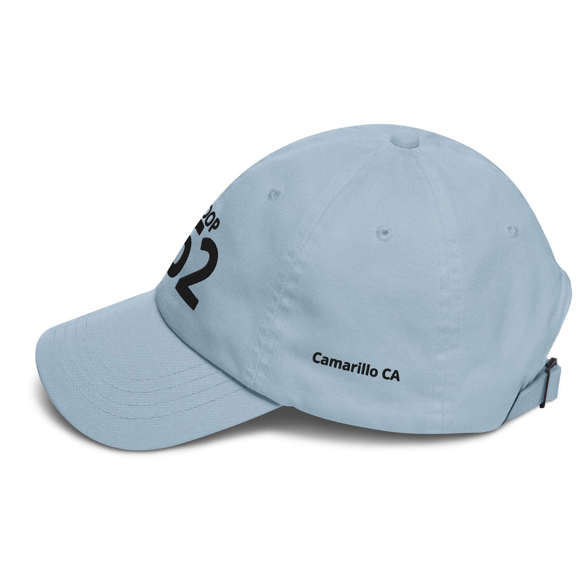 Light blue adjustable baseball cap with "Camarillo CA" and black graphic design on the side.