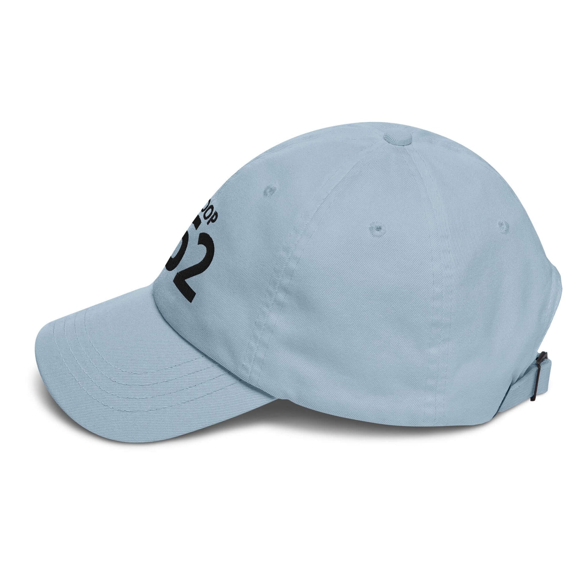 Light blue dad hat with black embroidered text, adjustable strap, and curved visor for casual style.