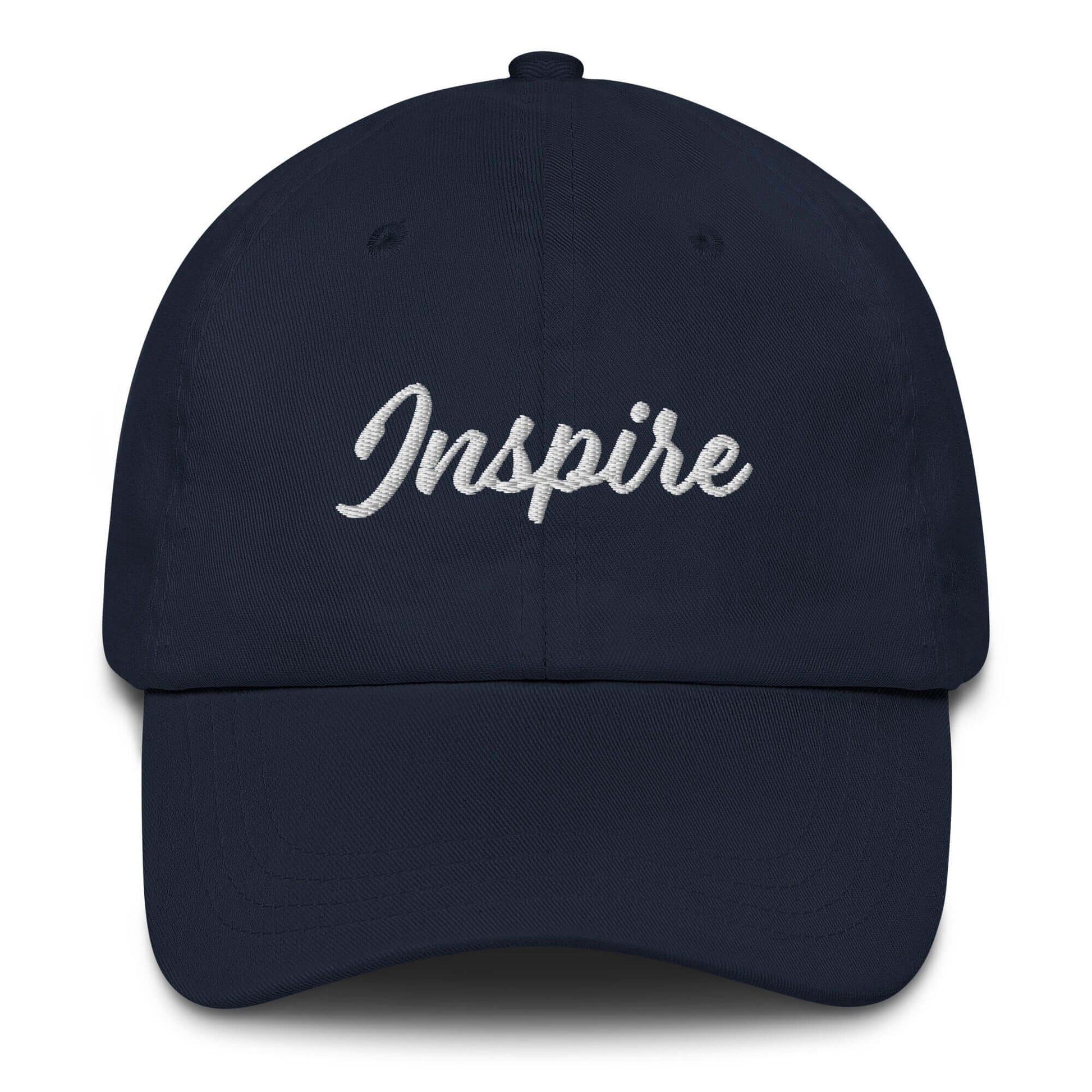 Navy blue hat with the word 'Inspire' elegantly embroidered across the front, promoting positivity and motivation.