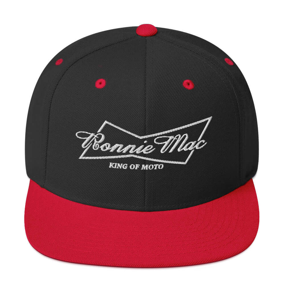 King of Moto embroidered snapback hat with Ronnie Mac logo, featuring a black crown and red brim, perfect for motocross fans.