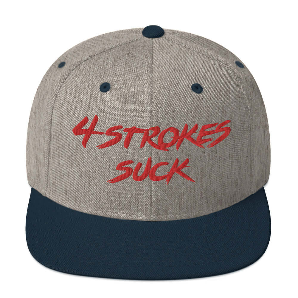 Grey snapback hat with "4 Strokes Suck" in red embroidery, celebrating motocross and 2-strokes lifestyle.