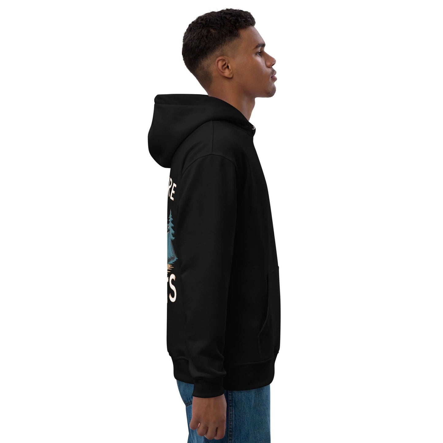 Side view of a man wearing the Adult Premium Eco Hoodie in black, featuring a cozy design suited for outdoor camping.