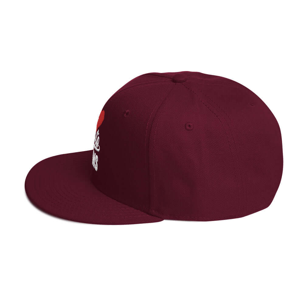 left side of Ronnie Mac 69's I Heart Moto Mom's Embroidered Snapback Hat (maroon)