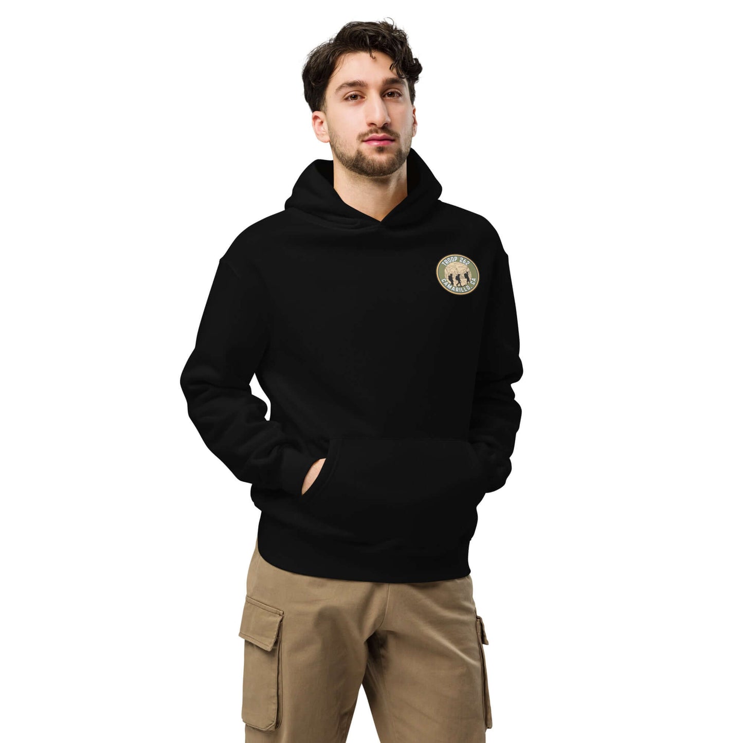 Model wearing black oversized hoodie with logo, perfect for hiking and outdoor adventures.