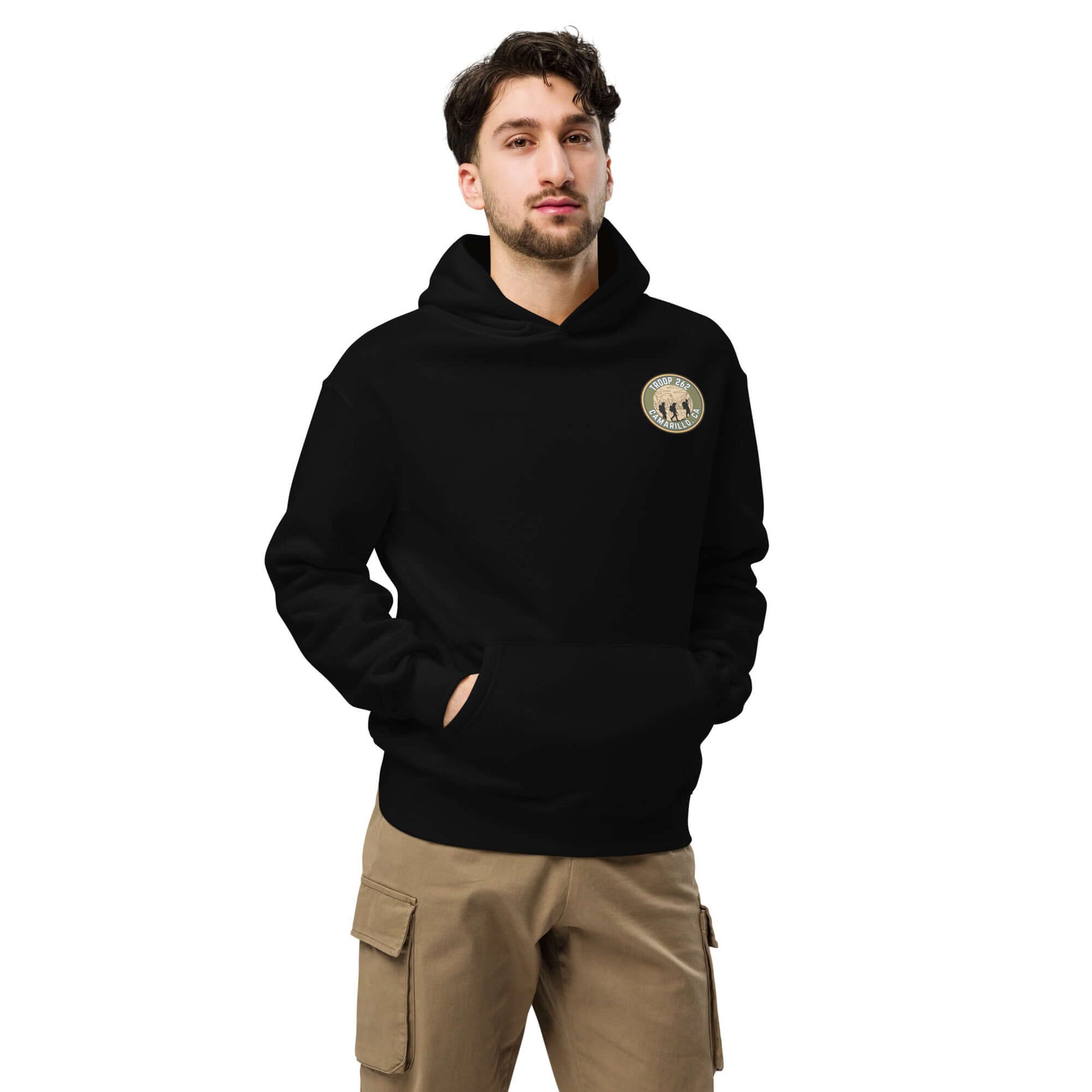 Model wearing black oversized hoodie with logo, perfect for hiking and outdoor adventures.