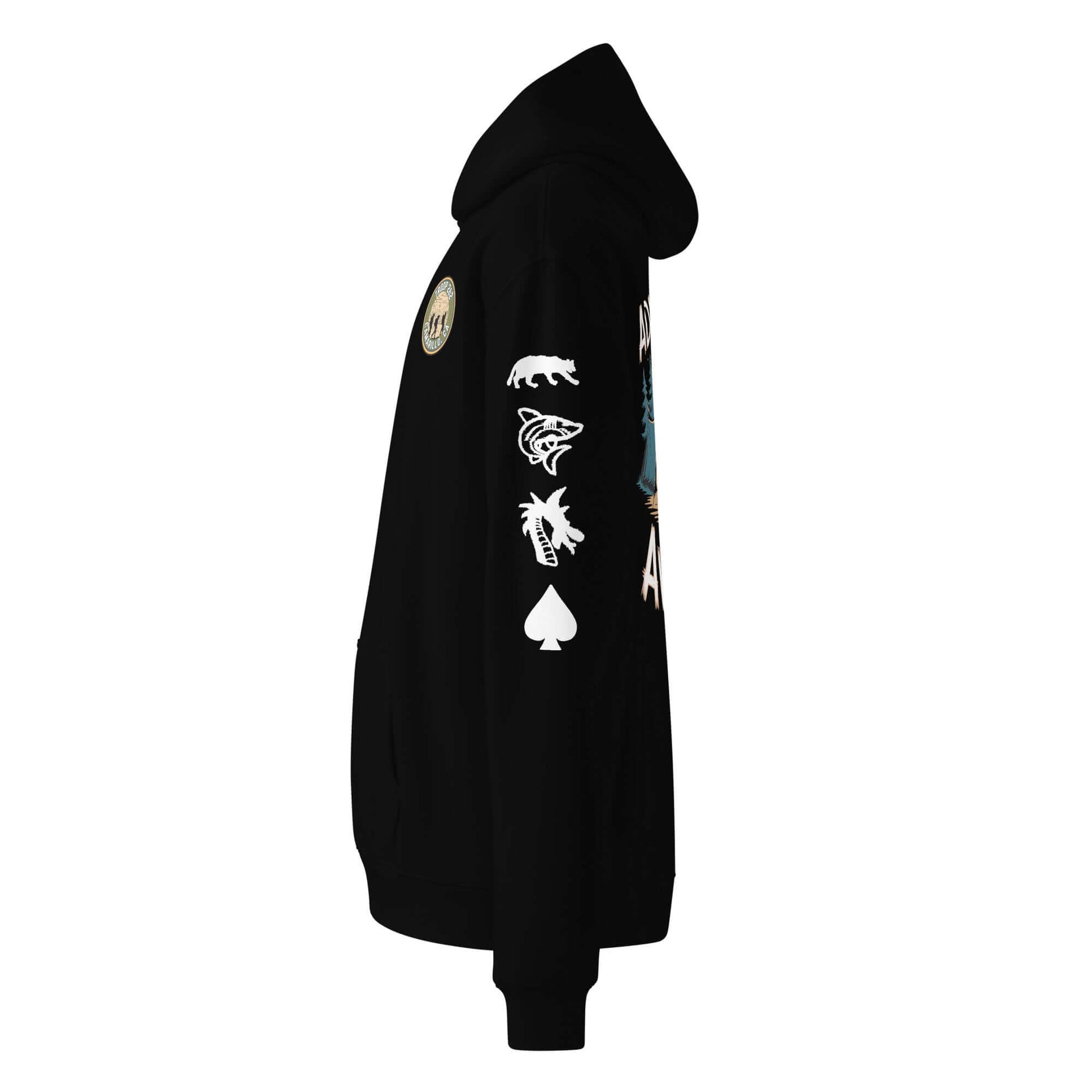 Side view of unisex oversized black hoodie with unique graphics and patches for outdoor adventures.