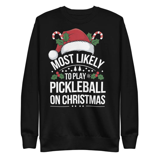 Festive pickleball Christmas sweatshirt with Santa hat, holly, and candy canes, featuring "Most Likely To Play Pickleball on Christmas" design.