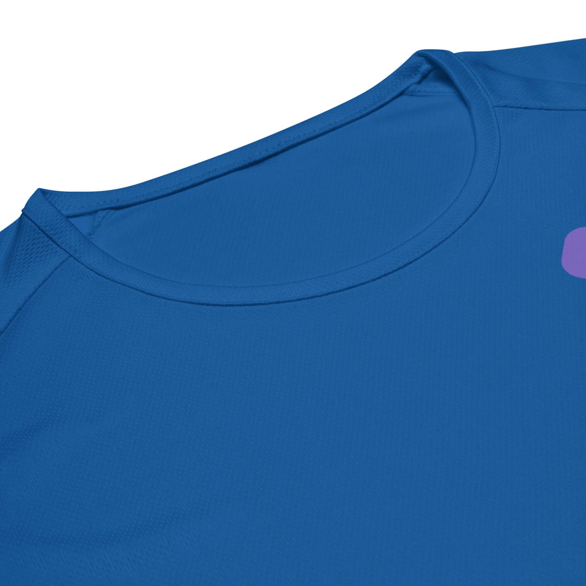 Close-up of a women's blue performance shirt featuring the vibrant 'LOVE' graphic for pickleball.