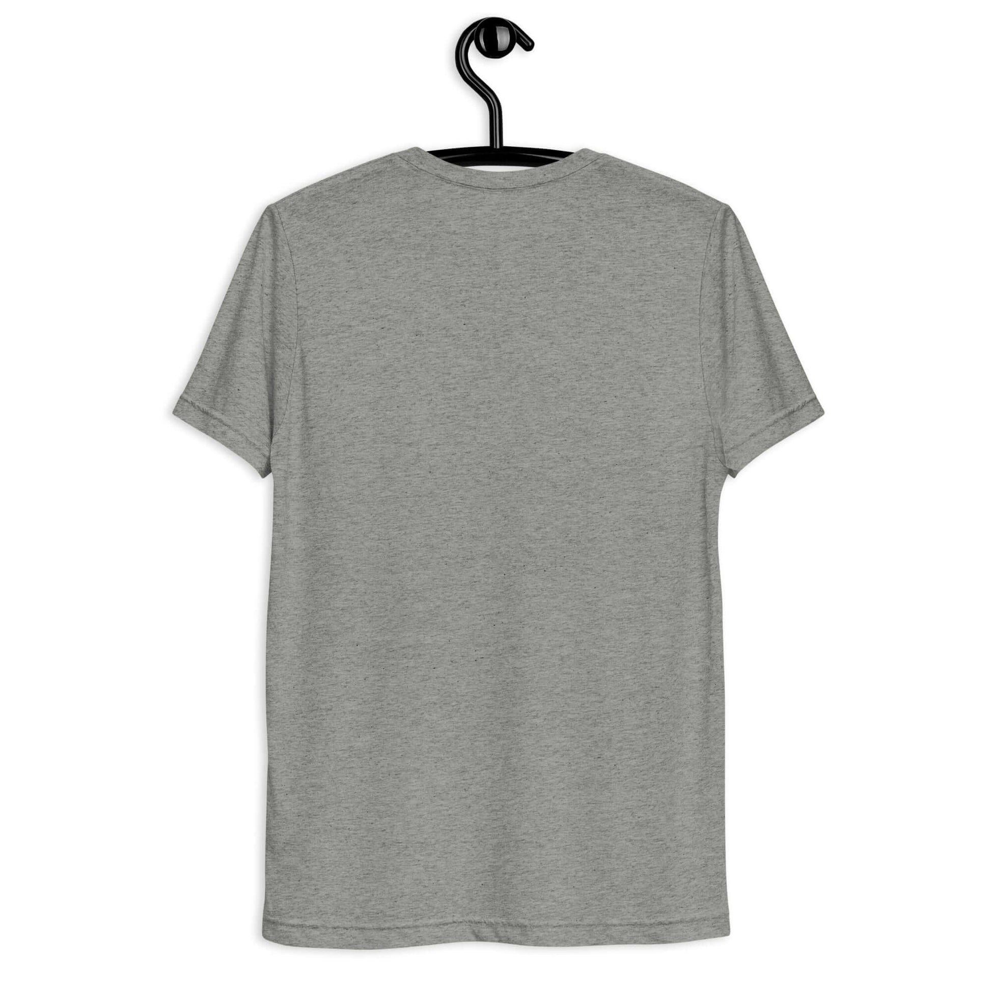 Back view of the Women's LOVE Pickleball Short Sleeve Shirt in a light gray color, hanging on a black hook.