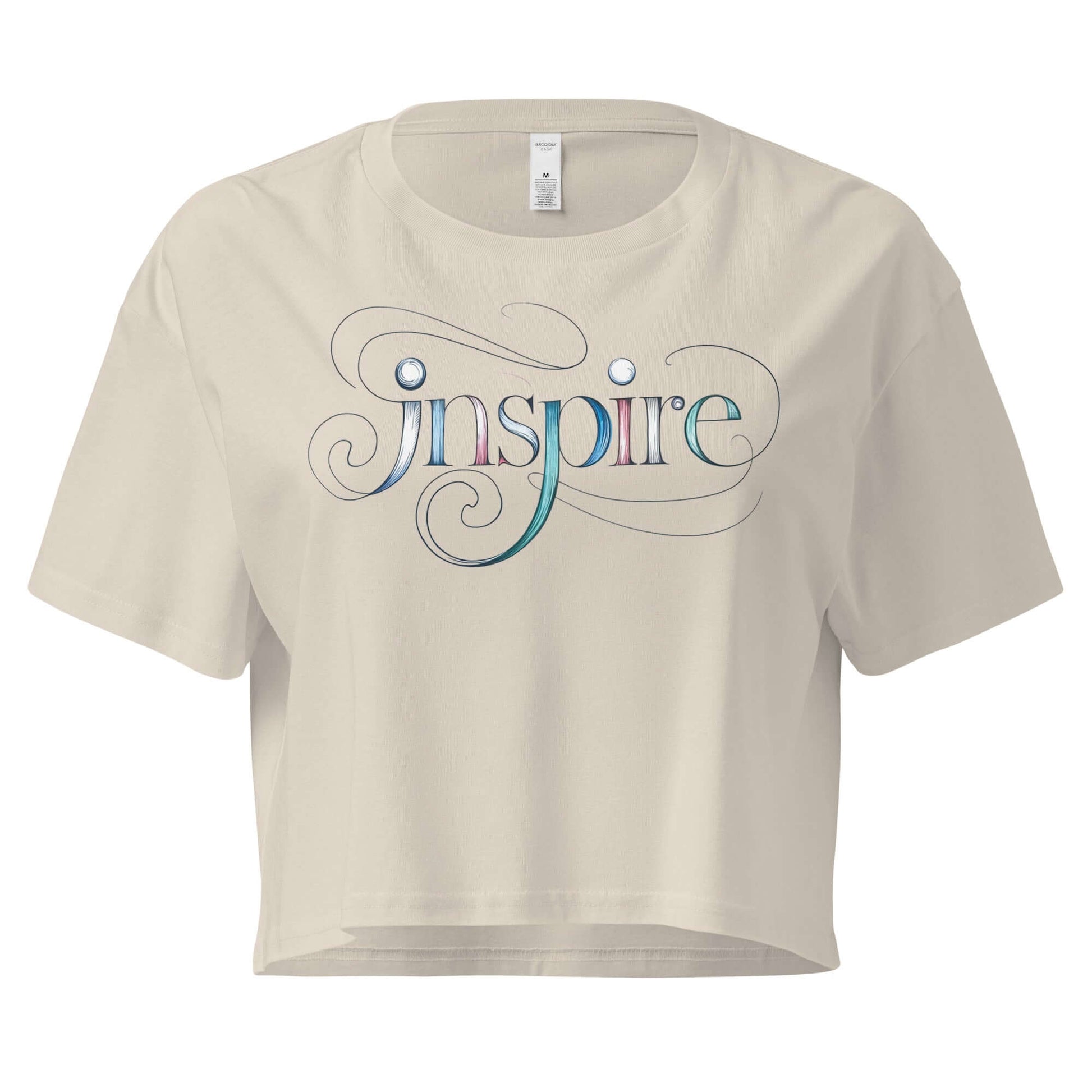 Inspire Sketch Women's Crop Top featuring a graceful "Inspire" word art design and flowing letters on a cream background.