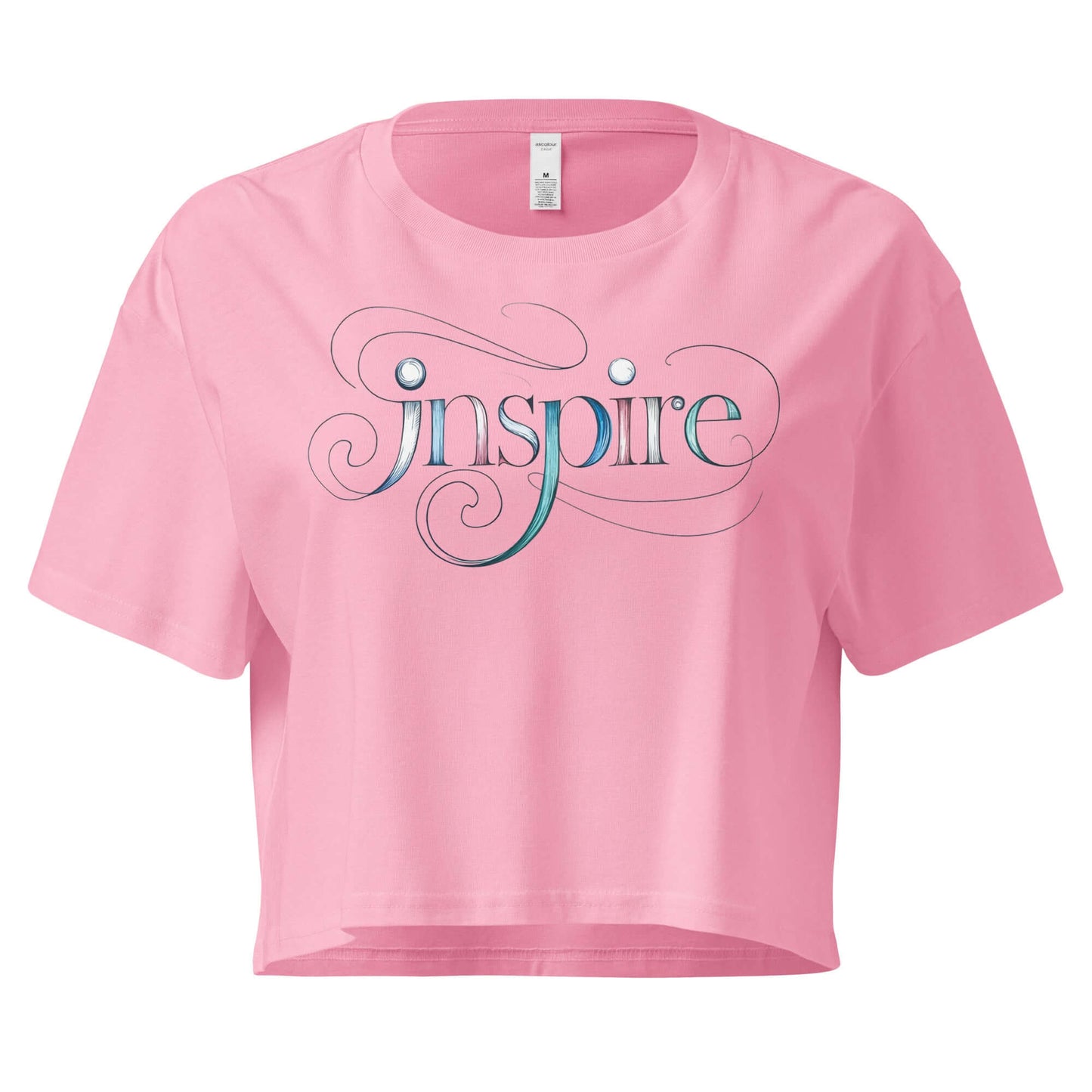 Pink women's crop top featuring the word "Inspire" in elegant, flowing letters with intricate designs.