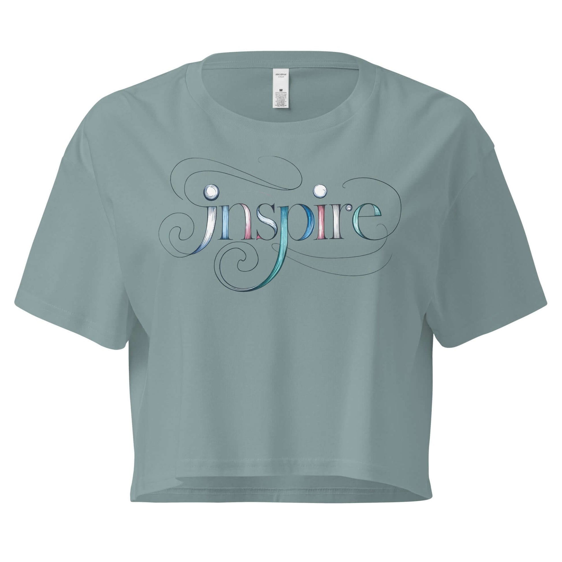 Grey women's crop top featuring the word "Inspire" with elegant swirls and patterns for a creative look.