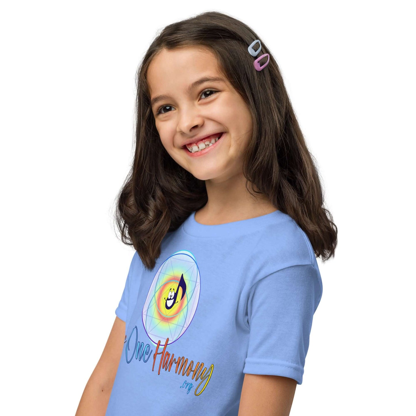 Happy girl wearing a light blue moisture-wicking t-shirt featuring 'As One Harmony' graphic design.