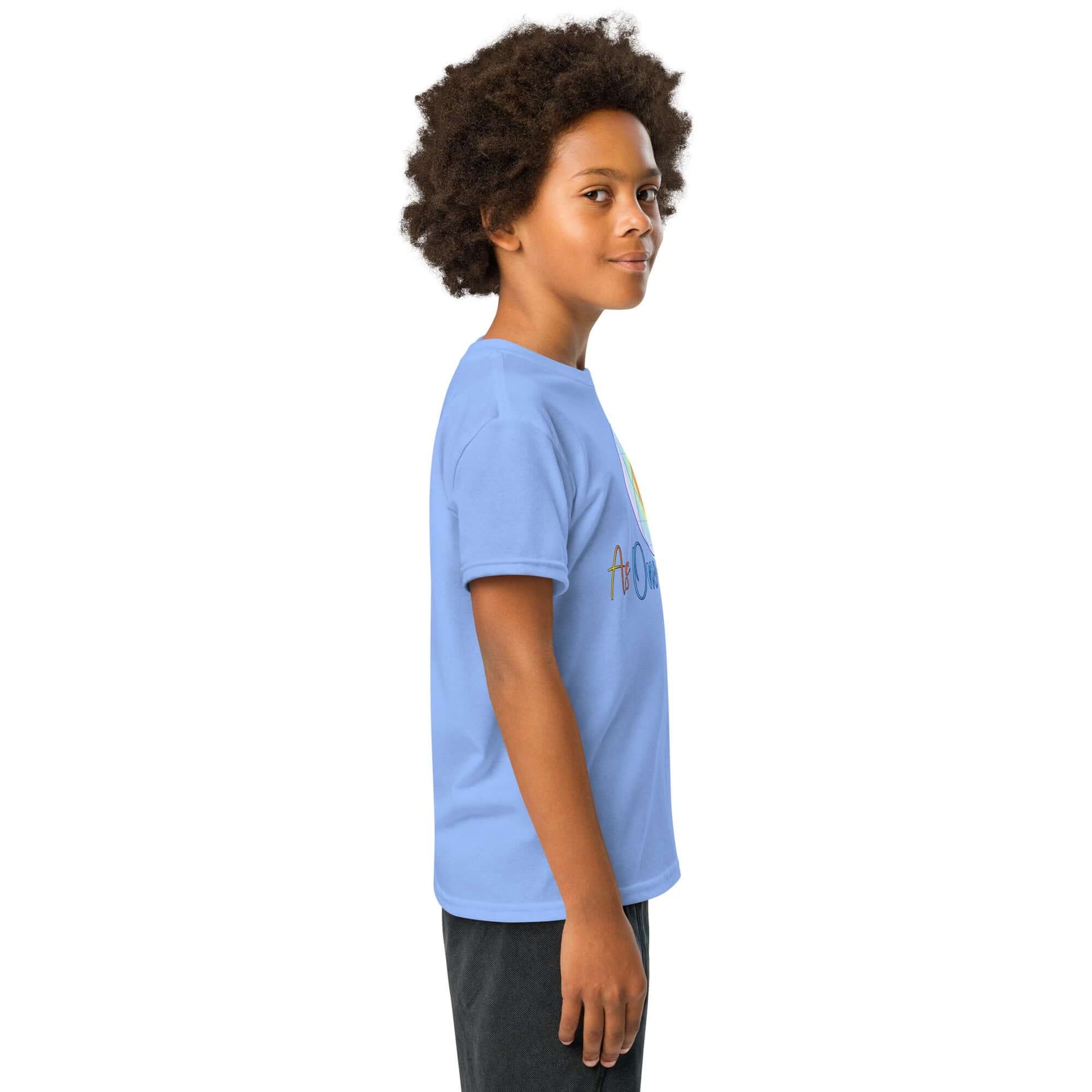 Side profile of a child wearing a blue moisture-wicking t-shirt, showcasing modern fit and comfort.